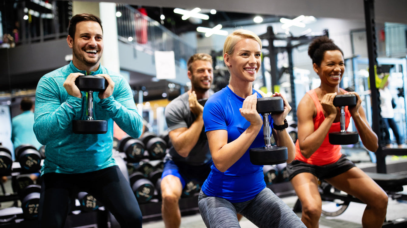 group of people wearing gym clothes exercising