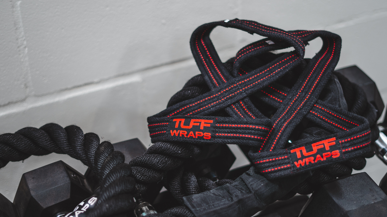 trainer doing pull ups outside