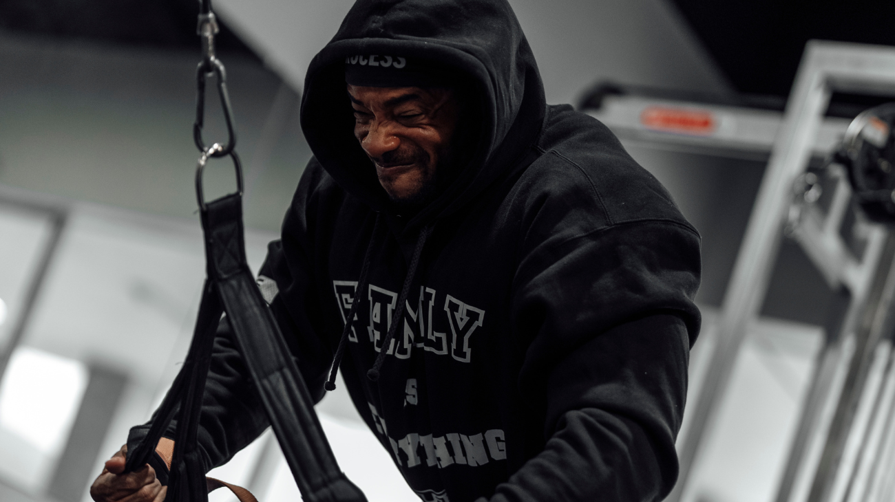 man in hoodie cold garage gym