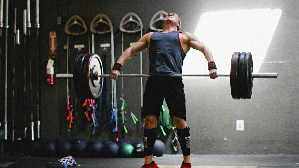 man performing power clean