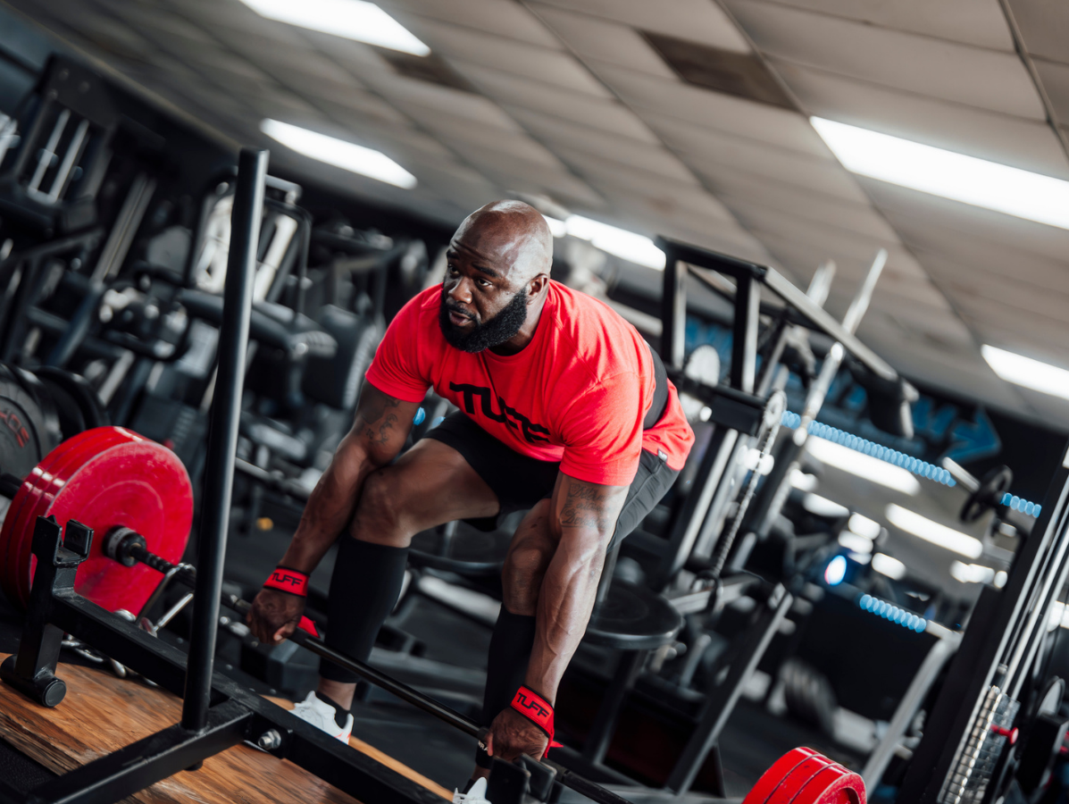 Strength athlete comparing SBD apparel alternatives including knee sleeves, belts, and wrist wraps