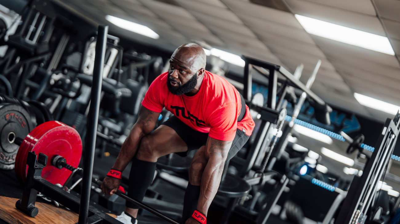 Strength athlete comparing SBD apparel alternatives including knee sleeves, belts, and wrist wraps