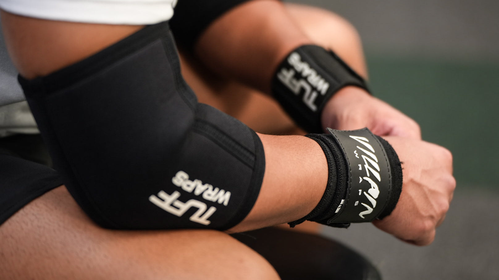 trainer wearing tuffwraps elbow sleeves