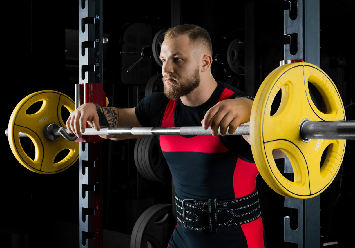 man with weightlifting belt about to squat
