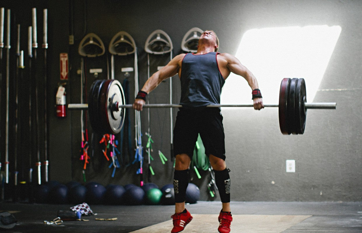 man performing power clean