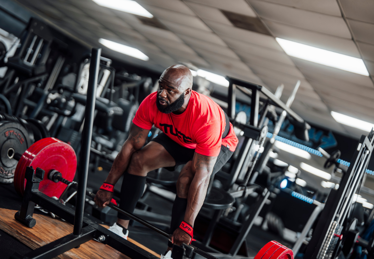 Strength athlete comparing SBD apparel alternatives including knee sleeves, belts, and wrist wraps