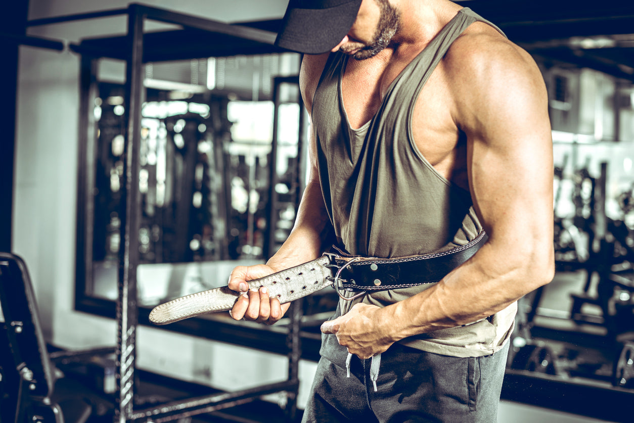 trainer wearing lifting belt