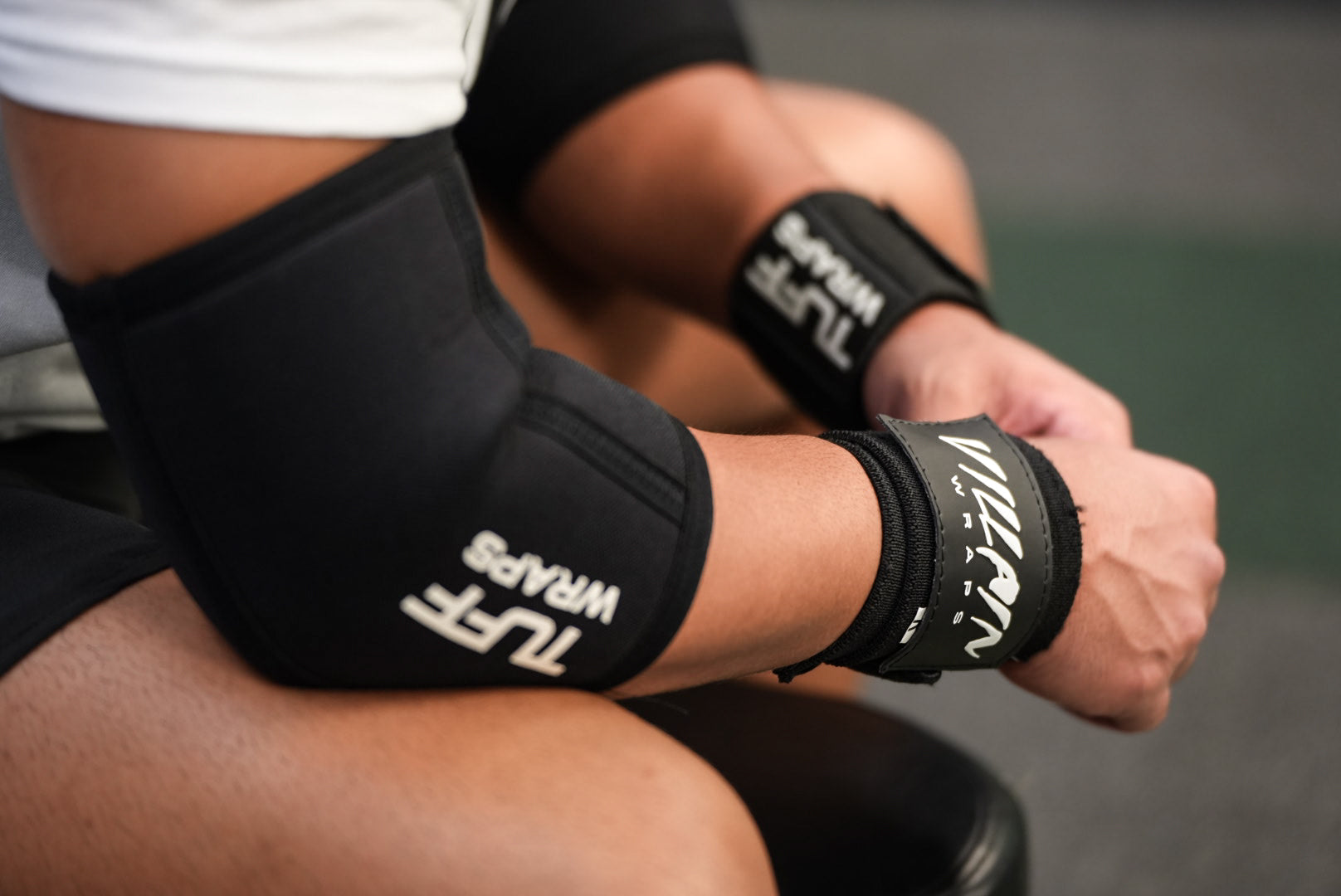 trainer wearing tuffwraps elbow sleeves